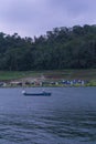 WONOSOBO, INDONESIA Ã¢â¬â JUNE 19, A fisherman who was sailing looking for fish in the middle of the lake